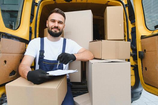 delivery-expert-with-shipment-boxes-in-van-photo